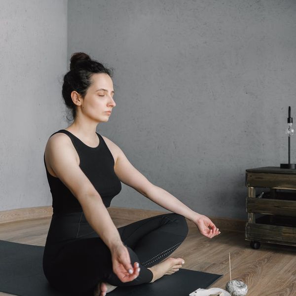 Person sitting peacefully, inspired by yoga practice.